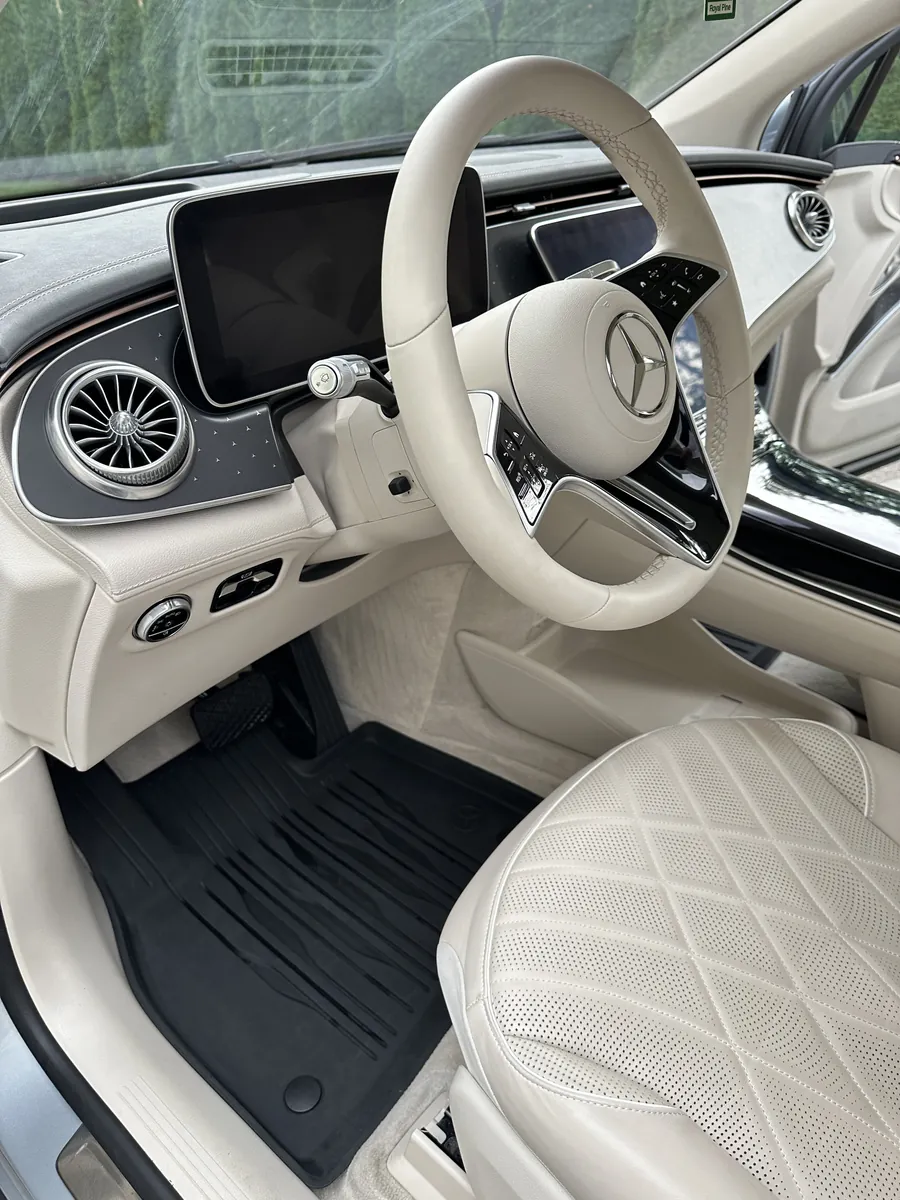 After: the same driver side with a clean floor mat and a clean steering wheel