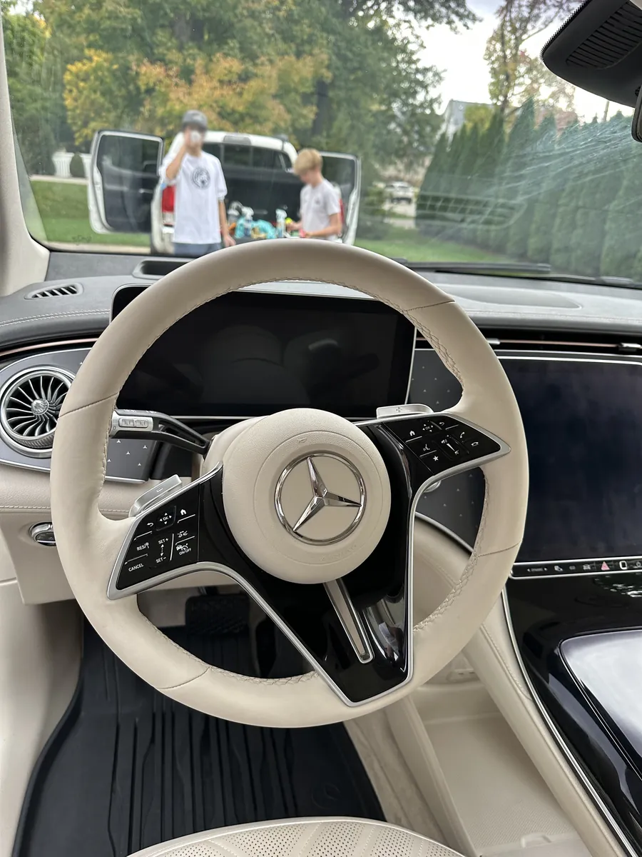 After: the same steering wheel with a clean cream rim
