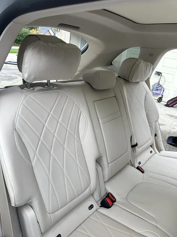 Clean cream leather rear seats after an interior detail